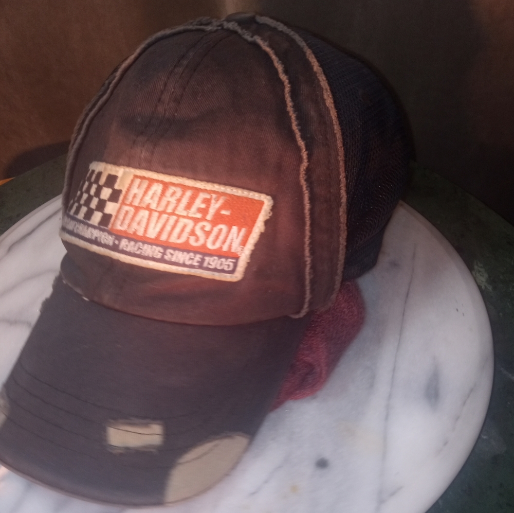 Harley Davidson rolled bill Baseball Cap, factory aged, almost new , adjustable.